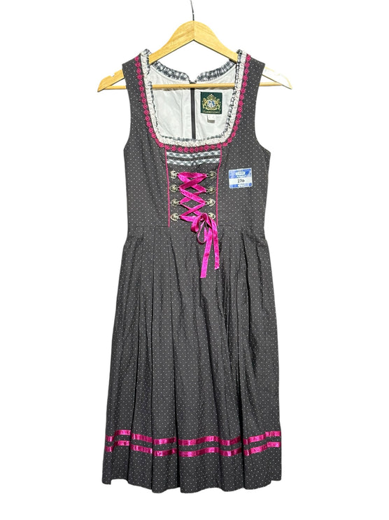 OutOf10 charcoal grey polka dot dirndl dress with hot pink lacing, ruffled neckline, and pleated skirt.
