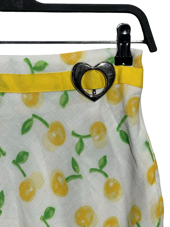 OutOf10 white A-line skirt with yellow cherry print, featuring a yellow waistband and silver heart-shaped buckle.