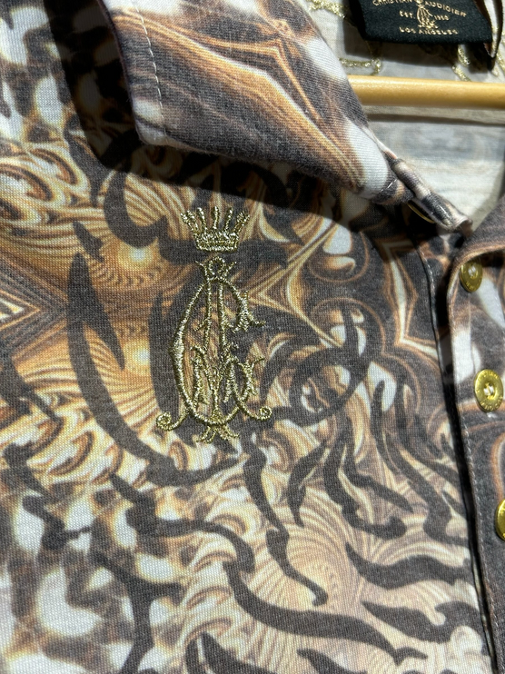 OutOf10 Christian Audigier polo shirt with brown tiger print, gold embroidery, and rhinestone button details.