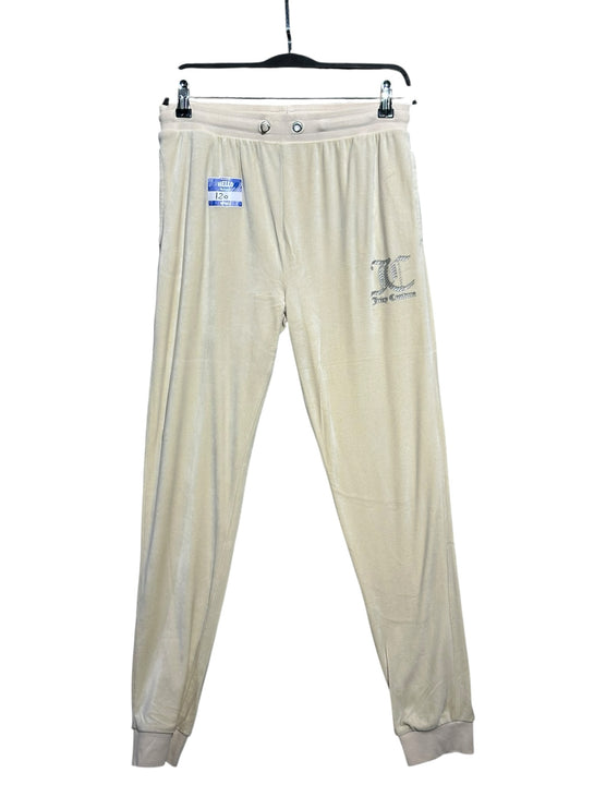 OutOf10 cream velour jogger sweatpants with elastic drawstring waist and ribbed cuffs hanging on a hanger