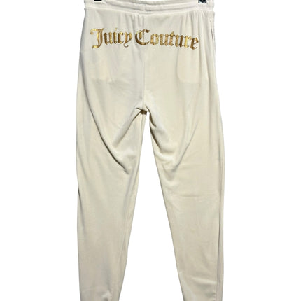 OutOf10 cream velour jogger sweatpants with gold-tone Juicy Couture logo embroidery on the back and ribbed cuffs.