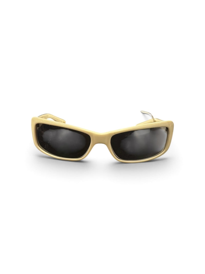 OutOf10 Y2K-inspired wrap-around sunglasses with a cream-toned frame and dark lenses for a modern, edgy aesthetic.