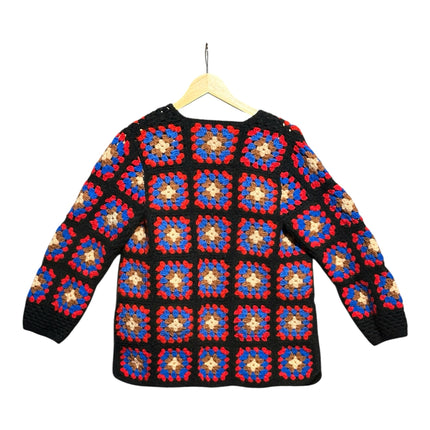 OutOf10 handmade crochet granny square cardigan in black, blue, red, and beige on a wooden hanger