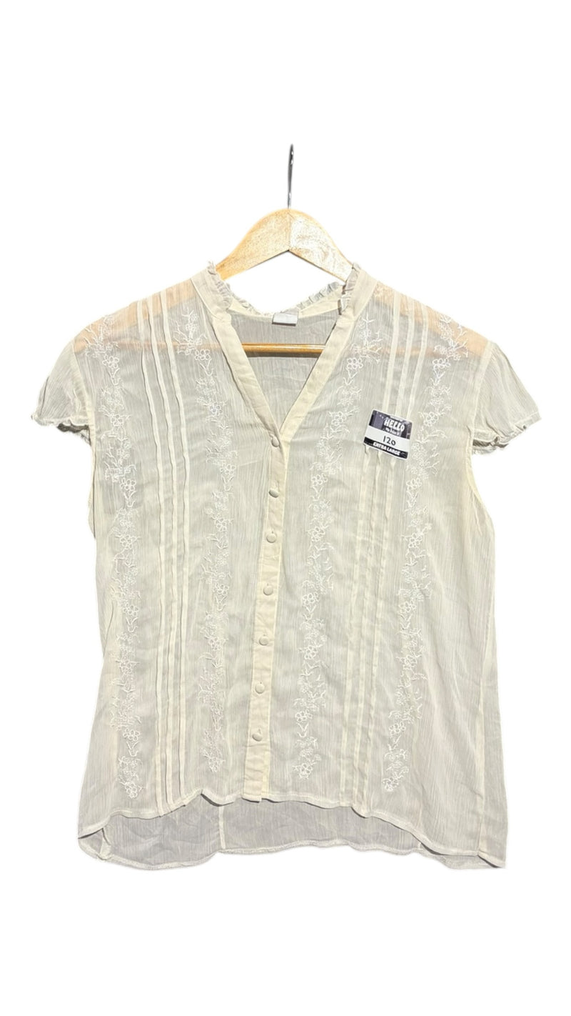 OutOf10 off-white button-down blouse with delicate floral embroidery, pintuck pleats, and ruffled cap sleeves.