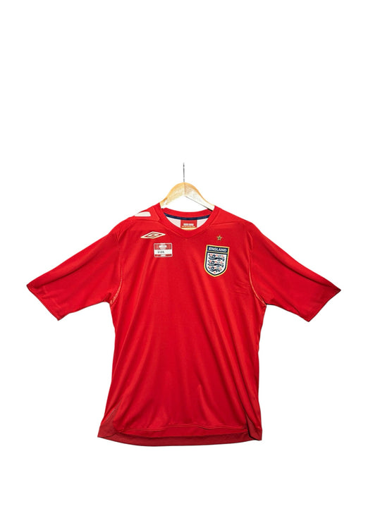 OutOf10 red England national football team jersey with crest and Umbro branding on a wooden hanger
