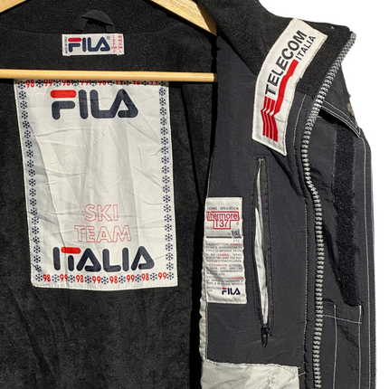 Interior of OutOf10 vintage FILA Ski Team Italia jacket showing branding, Thermore insulation label, and zipper.