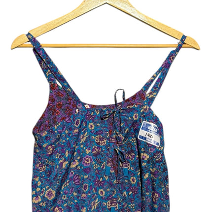 OutOf10 floral print camisole top with spaghetti straps, front tie detail, and vibrant blue and purple garden pattern.