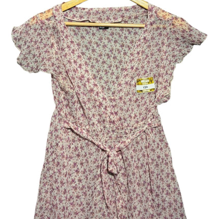 OutOf10 purple and white floral print short sleeve wrap blouse with a tie-waist detail on a wooden hanger