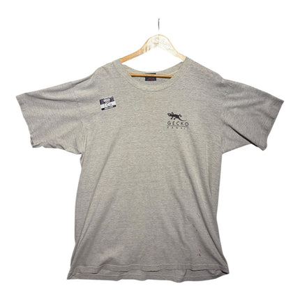 OutOf10 grey heather Gecko Hawaii graphic t-shirt with a small chest logo, hanging on a wooden hanger.