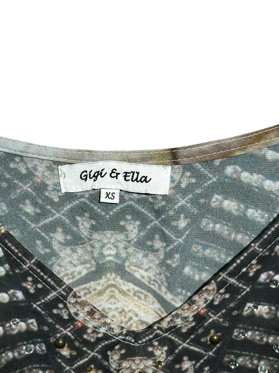 OutOf10 Gigi & Ella sleeveless printed romper featuring a V-neckline with delicate stud embellishments on earth tones.