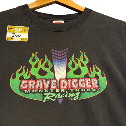OutOf10 black cotton t-shirt featuring a Grave Digger Monster Truck Racing graphic with vibrant green flames.