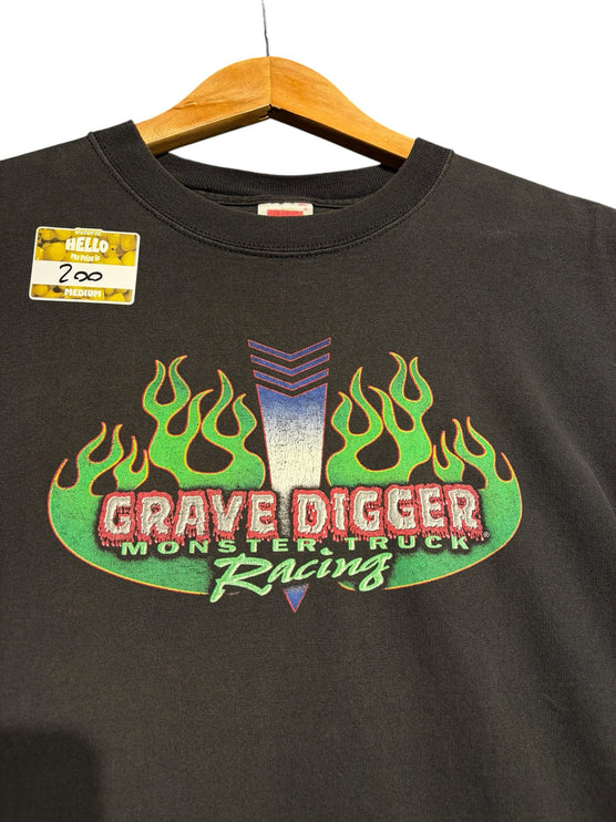 OutOf10 black cotton t-shirt featuring a Grave Digger Monster Truck Racing graphic with vibrant green flames.