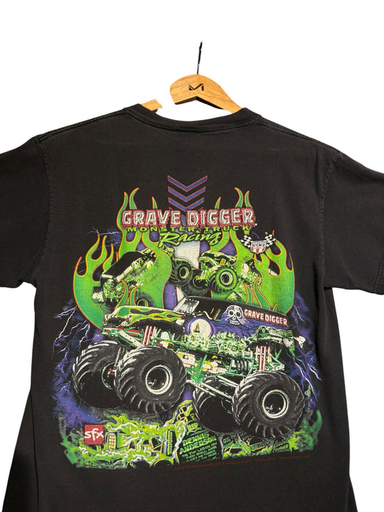 OutOf10 black cotton t-shirt featuring a vibrant Grave Digger monster truck graphic with green flames and lightning.