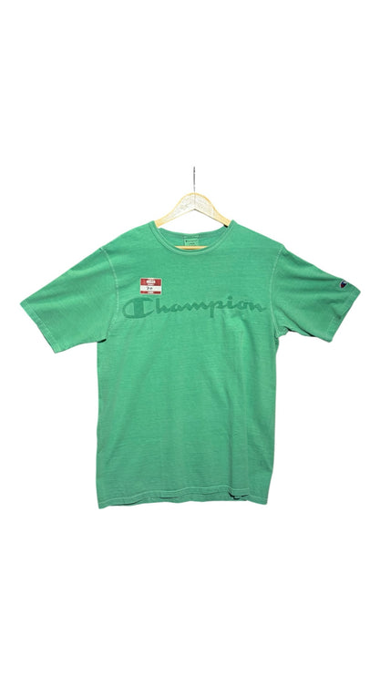 OutOf10 green Champion crew neck t-shirt with a vintage garment-dyed finish and tonal chest logo on a hanger