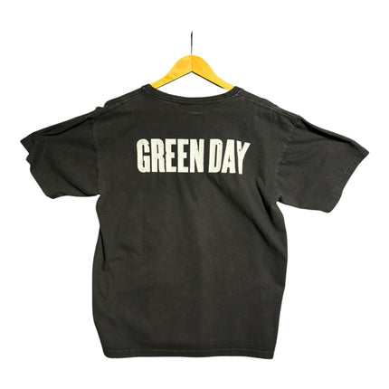 OutOf10 black Green Day American Idiot band t-shirt featuring a white logo on the back, hanging on a yellow hanger.