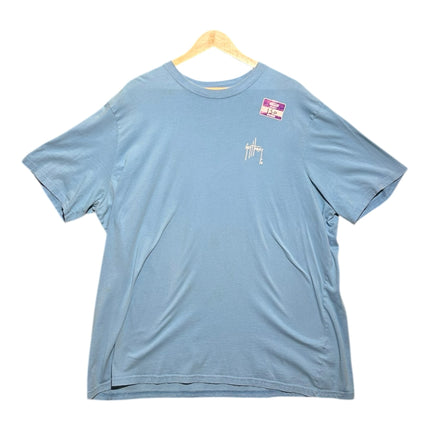 OutOf10 light blue Guy Harvey cotton t-shirt with a small chest logo, displayed on a wooden hanger.