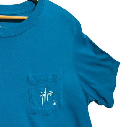 OutOf10 Guy Harvey teal cotton short sleeve t-shirt with a chest pocket and white signature logo on a wooden hanger