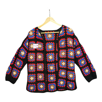 OutOf10 handmade crochet granny square cardigan in black, blue, red, and beige on a wooden hanger.