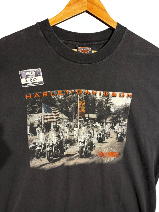 OutOf10 vintage-style black Harley-Davidson cotton t-shirt featuring a motorcycle riders graphic print and US flag.