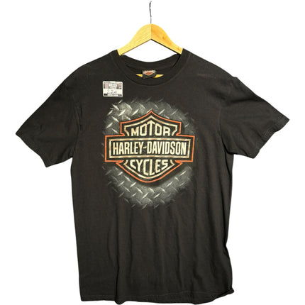 OutOf10 black Harley-Davidson cotton t-shirt with front shield logo on a diamond-plate background hanging on a hanger