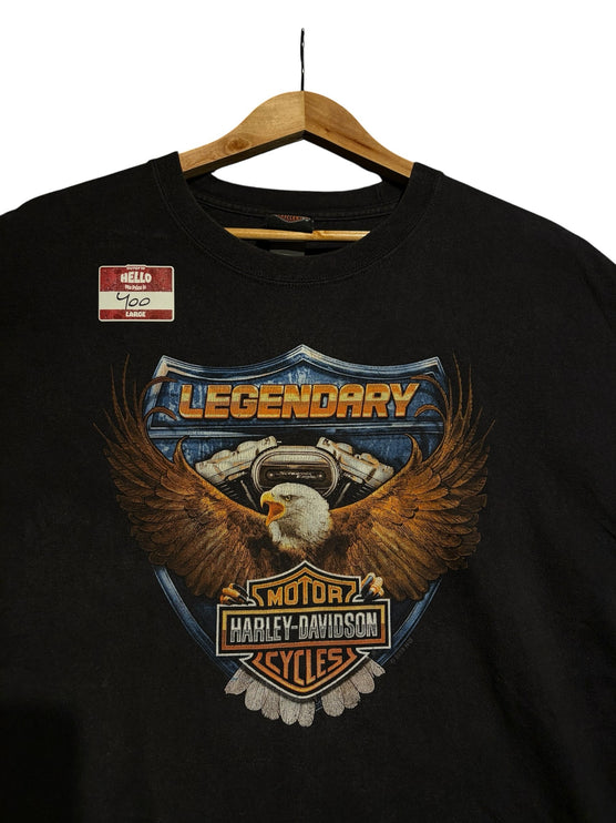 OutOf10 black Harley-Davidson Jeddah anniversary t-shirt featuring a detailed eagle and shield graphic on the front.