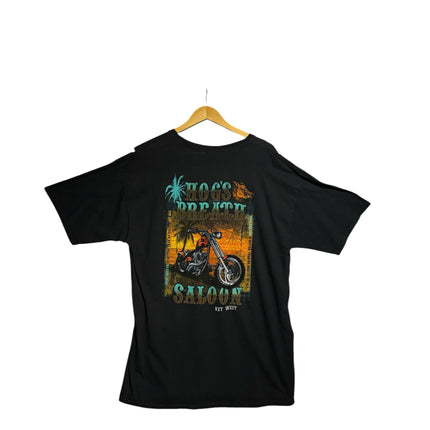OutOf10 black cotton t-shirt with a vibrant Hog's Breath Saloon motorcycle and tropical sunset graphic on the back