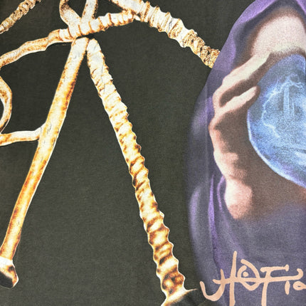 OutOf10 HOTEL 1171 olive cotton t-shirt featuring a hooded figure, glowing orb, and metallic nail graphic print.
