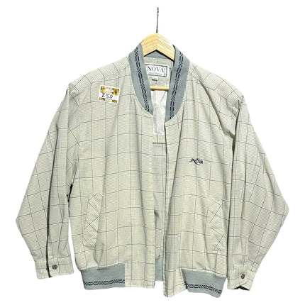 OutOf10 INOVA casual bomber jacket featuring a neutral grid-check pattern, ribbed collar, and embroidered chest logo.