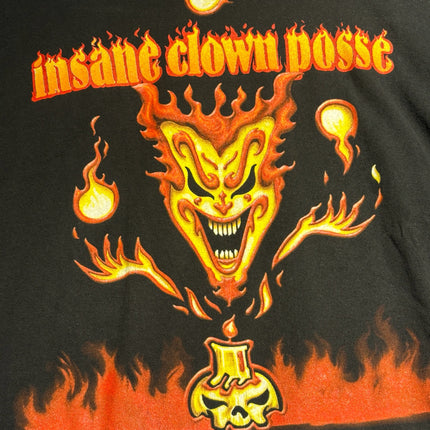 OutOf10 black cotton t-shirt featuring a vibrant Insane Clown Posse flaming jester and skull candle graphic print