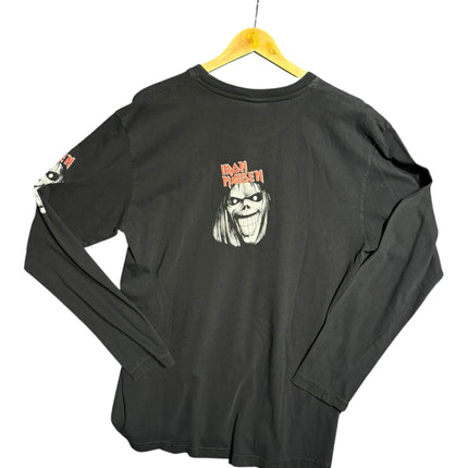 OutOf10 black Iron Maiden long sleeve cotton t-shirt with Eddie graphic on the back and sleeve, hanging on a hanger.