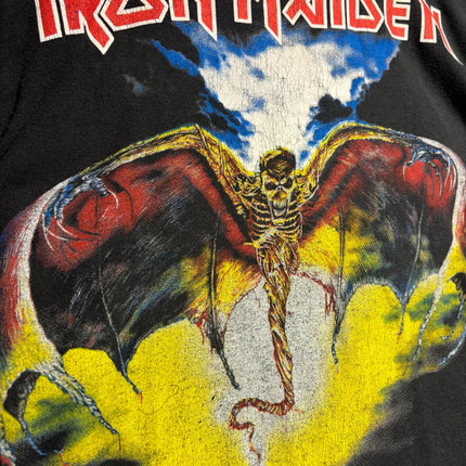 OutOf10 vintage black Iron Maiden graphic t-shirt featuring a winged skeletal figure in yellow and blue