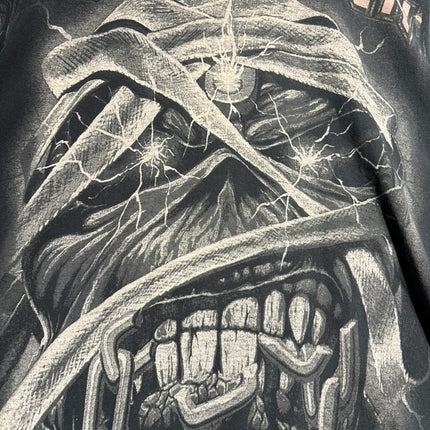 OutOf10 vintage Iron Maiden graphic t-shirt featuring a distressed Eddie mascot print on a washed-black cotton base.