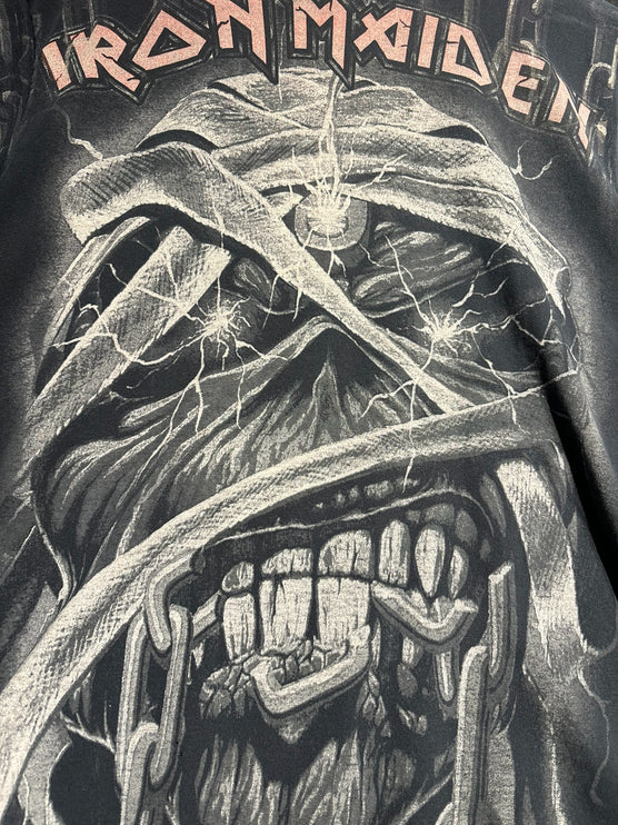 OutOf10 vintage Iron Maiden graphic t-shirt featuring a distressed Eddie mascot print on a washed-black cotton base.