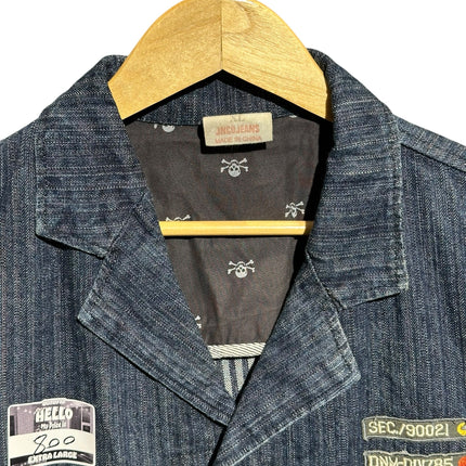 OutOf10 JNCO JEANS dark wash denim workwear jacket with skull print lining, notched lapels, and military patches.
