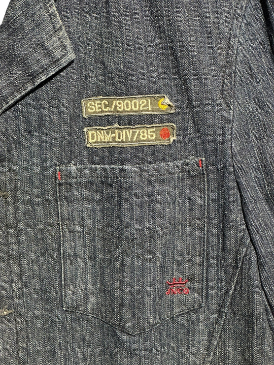 OutOf10 JNCO JEANS dark wash herringbone denim workwear jacket featuring military-style patches and chest pocket