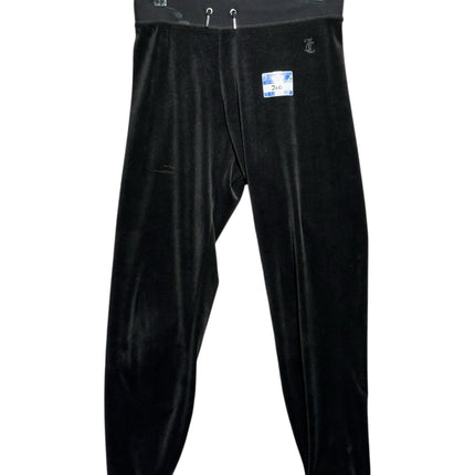 OutOf10 black Juicy Couture velour lounge jogger pants with an elastic drawstring waistband and ribbed ankle cuffs.