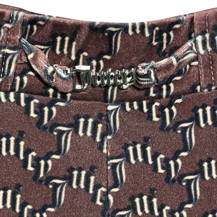 OutOf10 Juicy Couture brown velour trousers with monogram print and silver-tone logo hardware at the waistband.