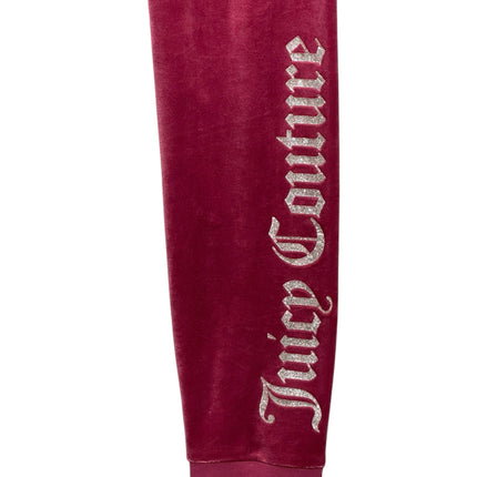 OutOf10 Juicy Couture burgundy velour joggers featuring a shimmering glitter logo down the leg and ribbed ankle cuffs.