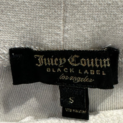 OutOf10 Juicy Couture Black Label joggers featuring a black fabric brand tag on soft off-white terry cloth material
