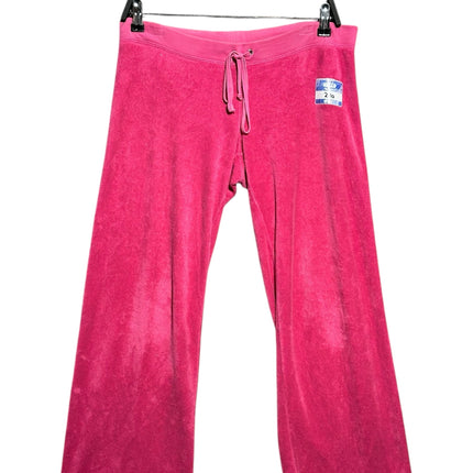 OutOf10 Juicy Couture hot pink velour lounge pants with an elasticated drawstring waistband on a hanger.