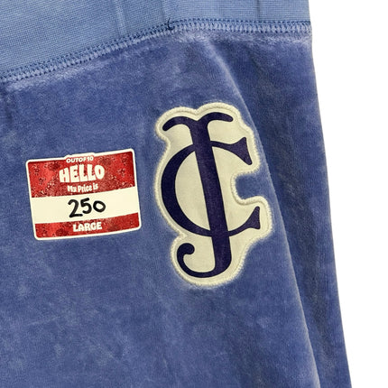 OutOf10 Juicy Couture periwinkle blue velour lounge jogger pants featuring an embroidered JC logo patch on the hip