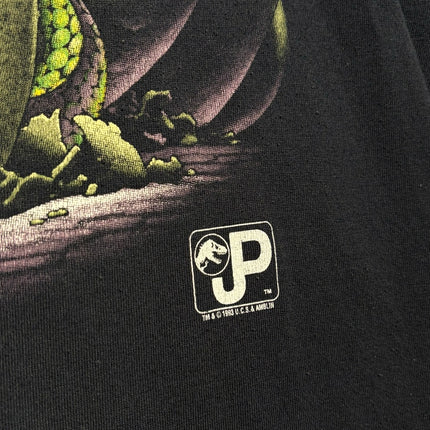 OutOf10 black crewneck t-shirt featuring a detailed green hatching dinosaur egg graphic and Jurassic Park logo print.