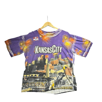 OutOf10 vintage purple crewneck t-shirt featuring a vibrant Kansas City skyline graphic print with firework accents.