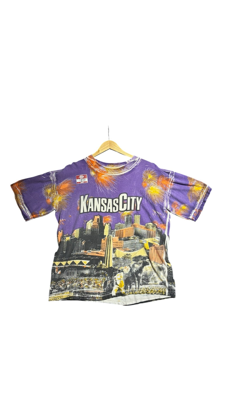 OutOf10 vintage purple crewneck t-shirt featuring a vibrant Kansas City skyline graphic print with firework accents.