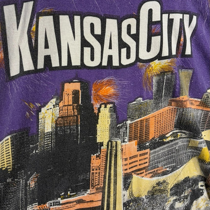 OutOf10 vintage purple crewneck t-shirt featuring a vibrant Kansas City skyline graphic print with firework accents.