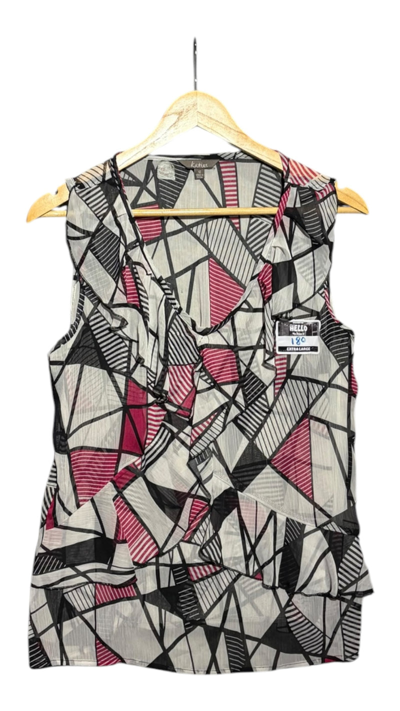 OutOf10 Katies sleeveless blouse featuring a black, white, and magenta geometric print with ruffle V-neck detailing.