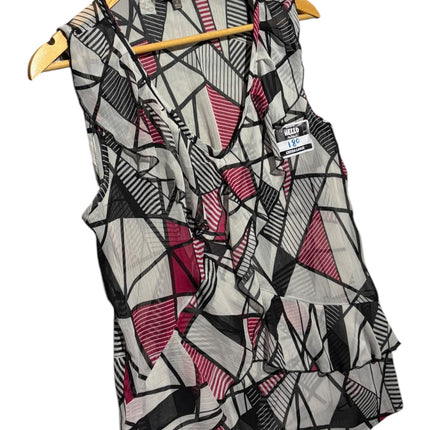 OutOf10 Katies sleeveless blouse featuring a black, white, and magenta geometric print with ruffle front detailing.