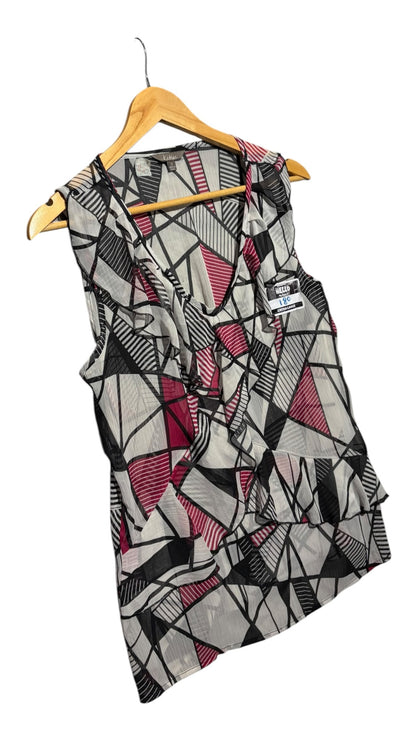 OutOf10 Katies sleeveless blouse featuring a black, white, and magenta geometric print with ruffle front detailing.