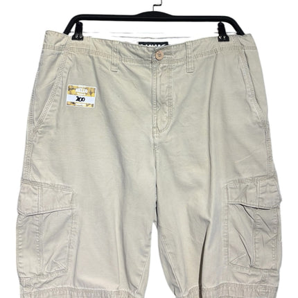 OutOf10 men's khaki cotton cargo shorts with side pockets and button-and-zip fly, hanging on a black hanger.