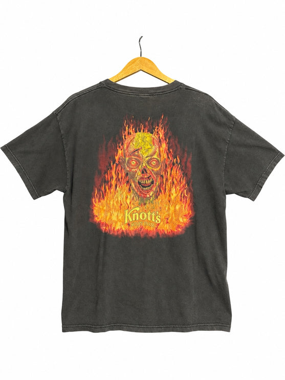 OutOf10 vintage washed-black cotton t-shirt featuring a vibrant fiery skull graphic on the back for Knott's Scary Farm.